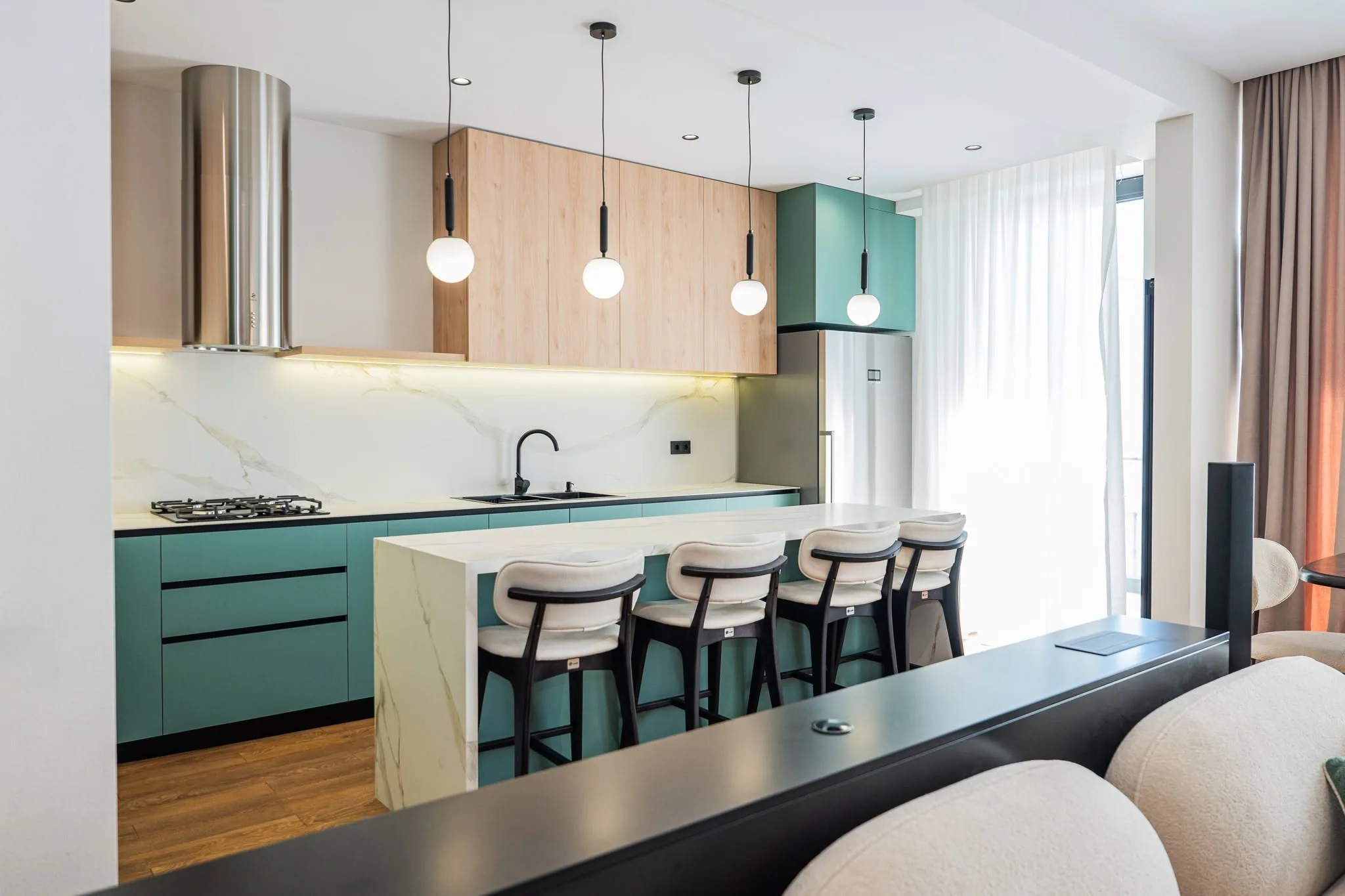 Green island kitchen — custom furniture by Kencho Group, Tbilisi