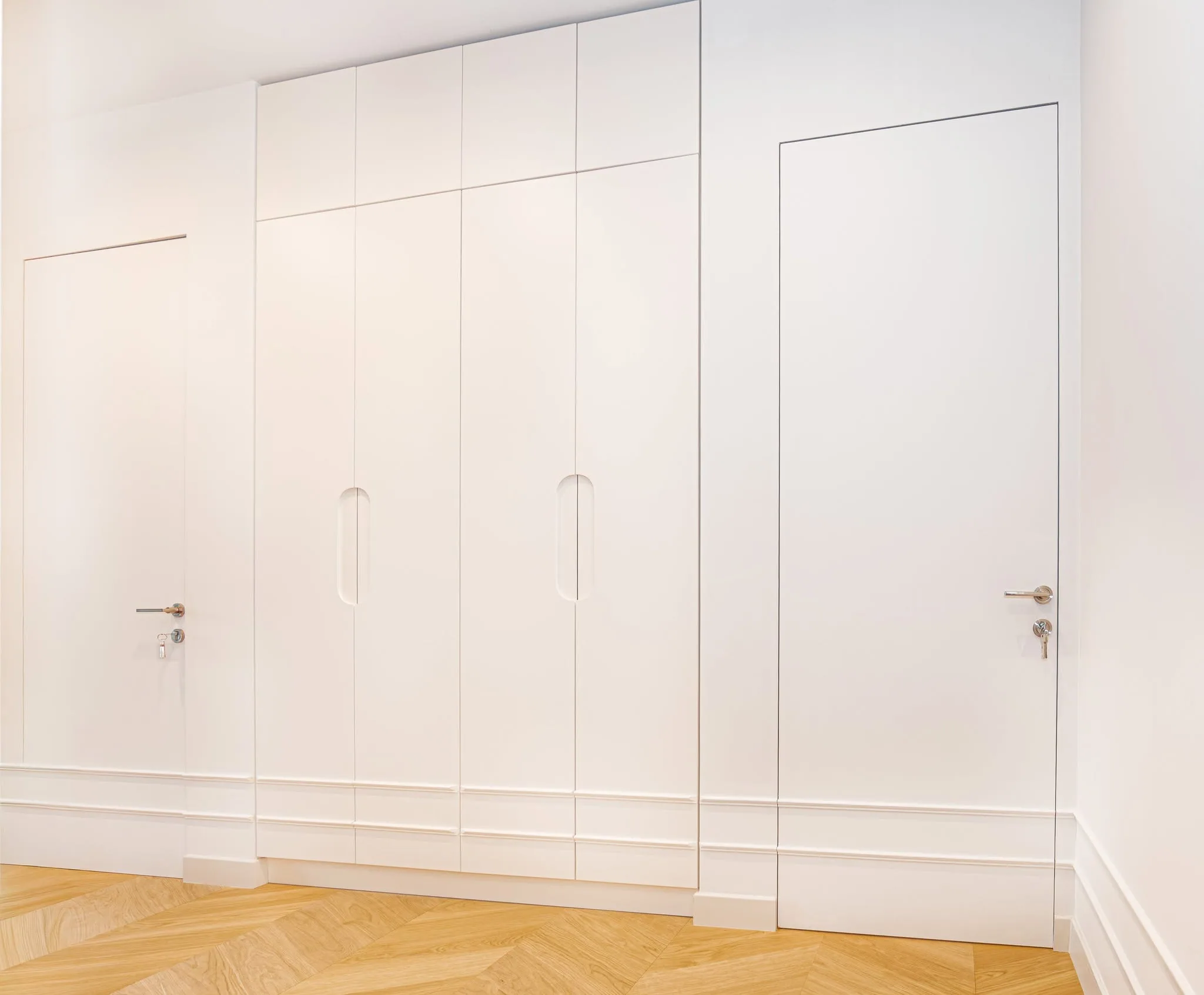 Flush white wardrobe wall — custom furniture by Kencho Group, Tbilisi