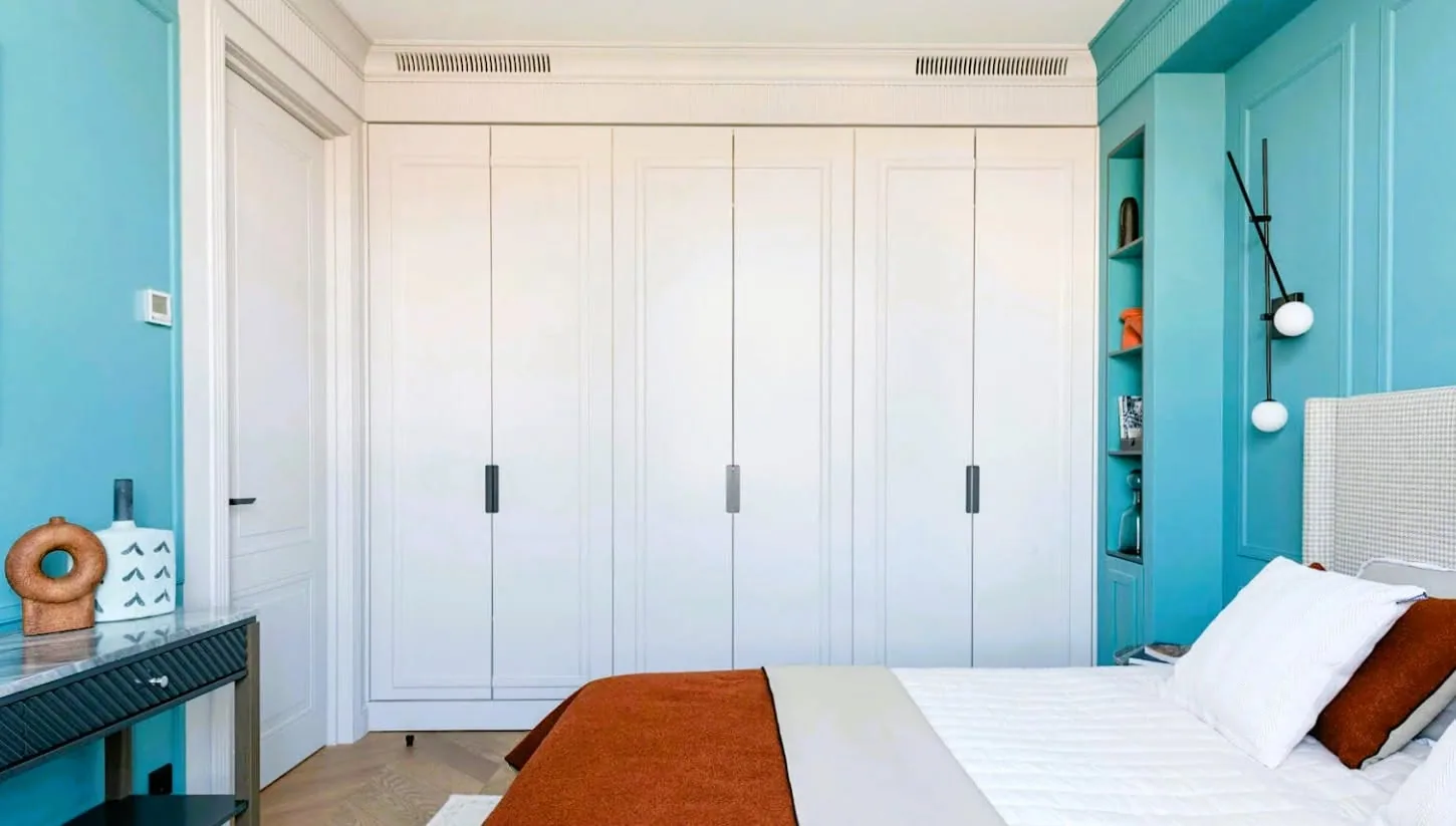 White wardrobe teal bedroom — custom furniture by Kencho Group, Tbilisi