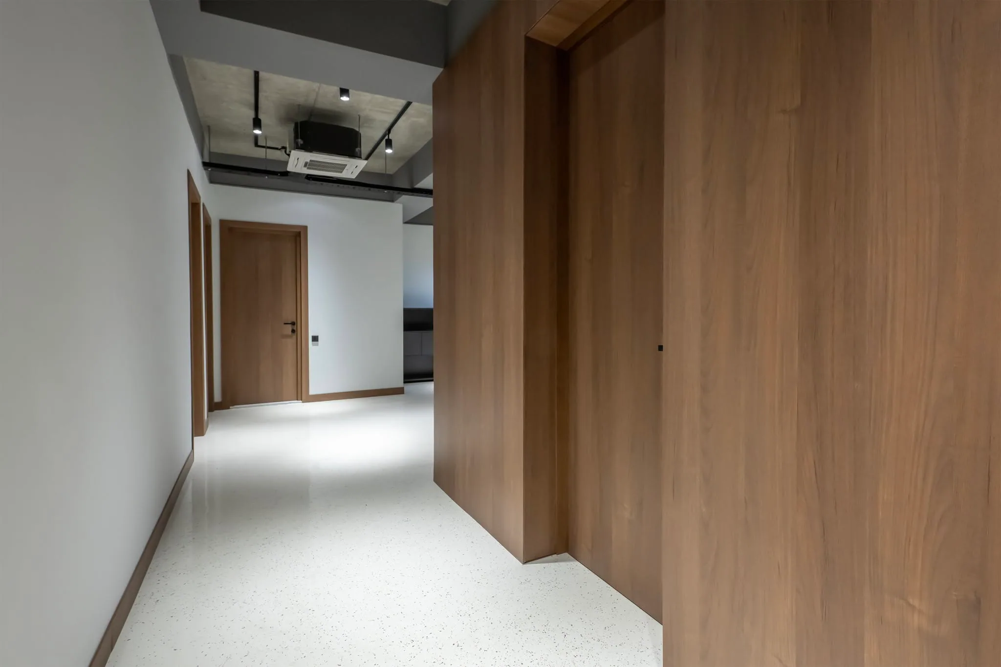 Office walnut corridor — custom furniture by Kencho Group, Tbilisi
