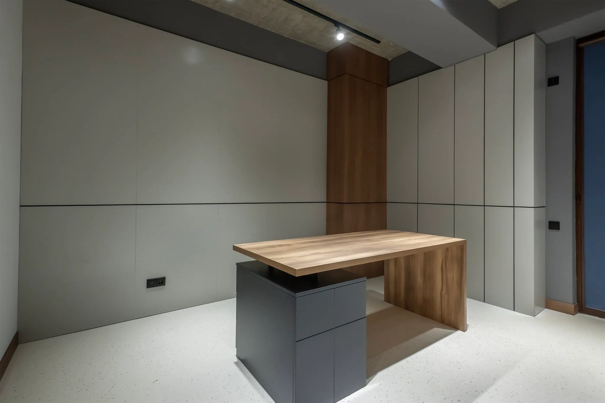 An office space mid fit-out, bare concrete ceiling and a single carcass